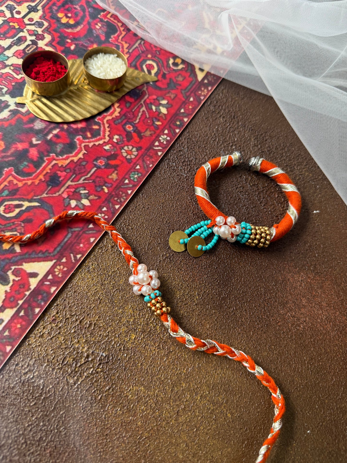 Orange Pearl Couple Rakhi